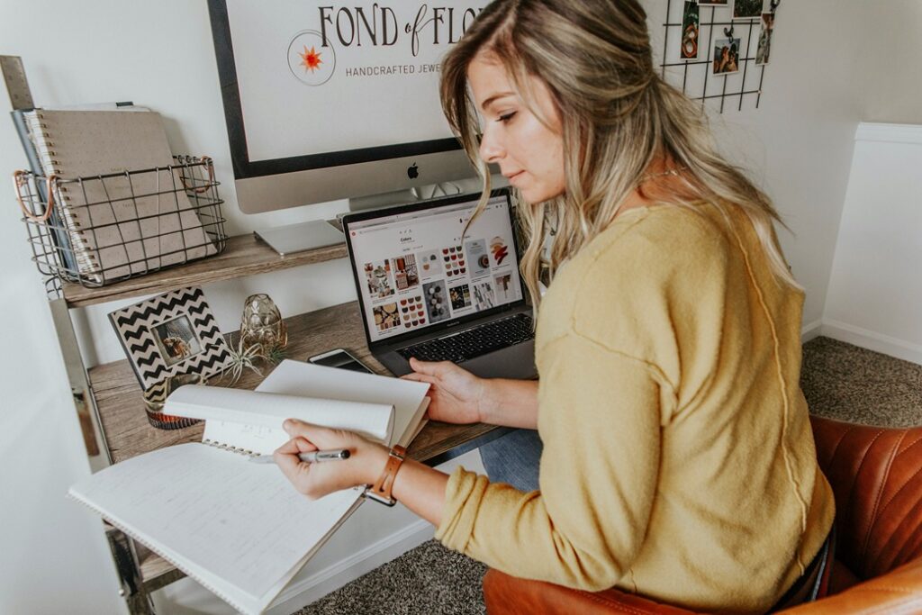 Interior designer at computer planning new website 