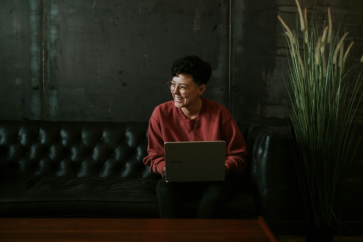 Interior designer comparing website builders on a laptop