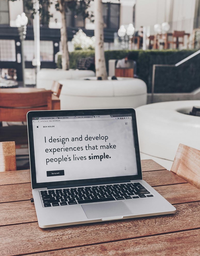 Interior designer website hero page messaging example on laptop